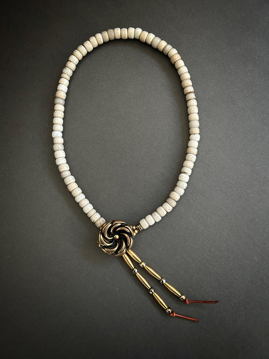Button-on necklace with antique white North American trade beads