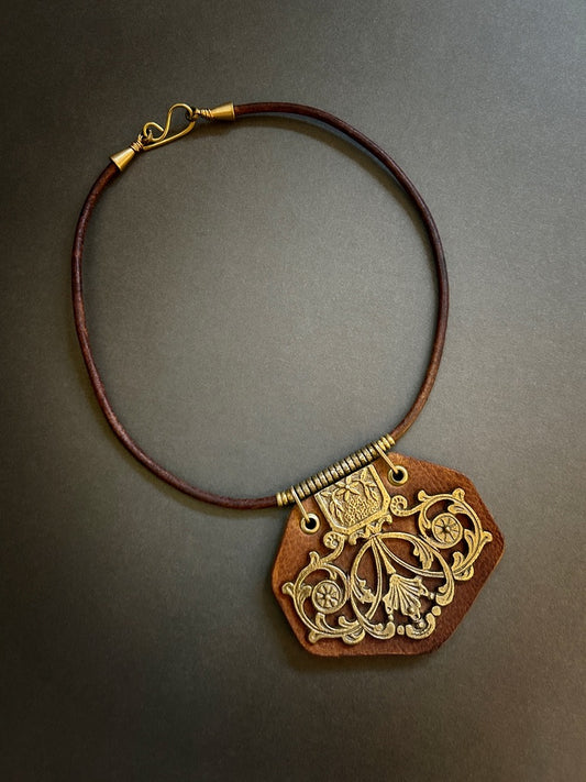Brass hardware leather pendant necklace with flourishes and flowers