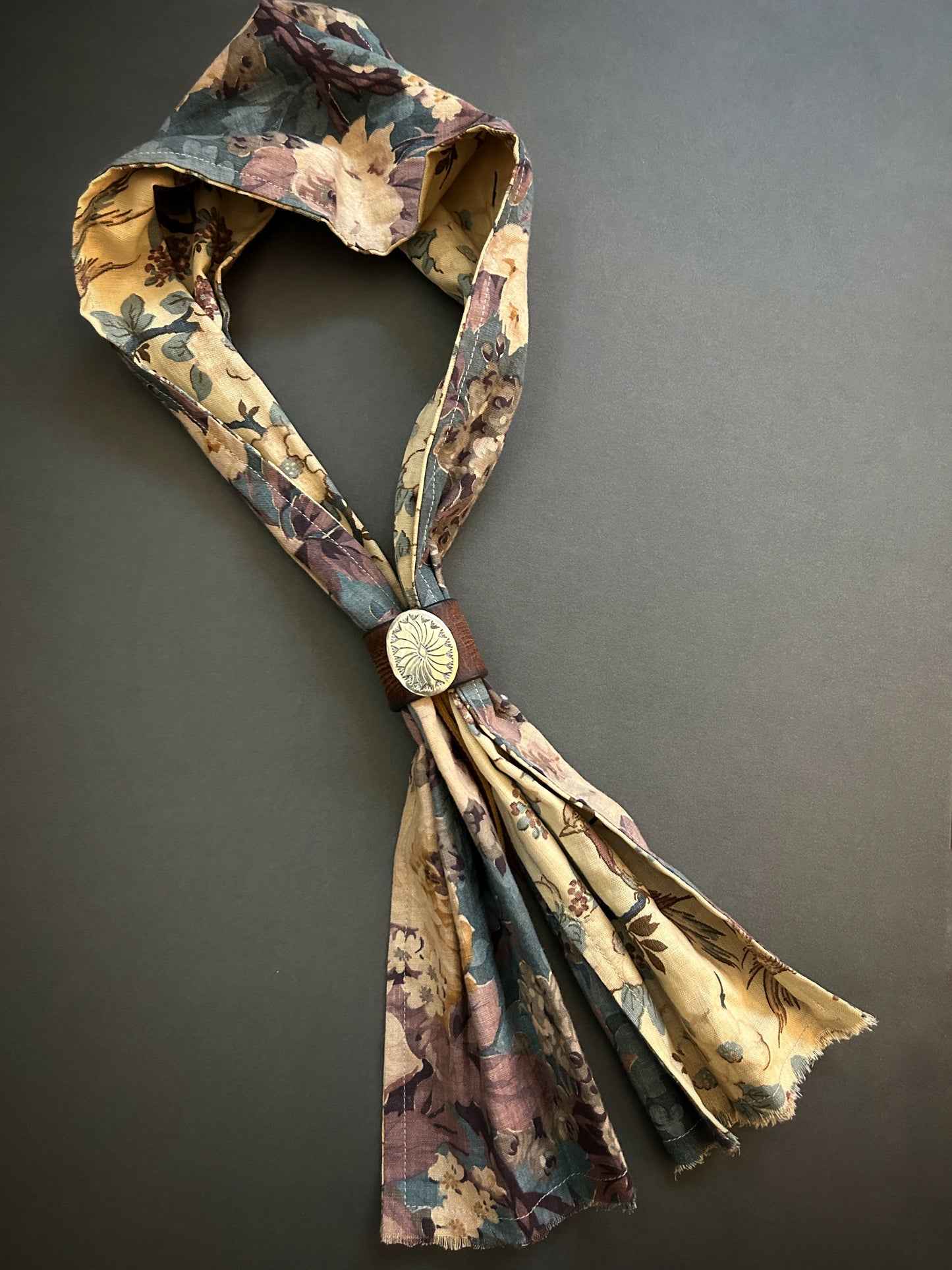 Scarf of 1940s cotton prints with concho leather slide